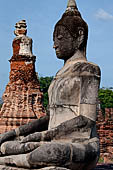 Ayutthaya, Thailand. Wat Mahathat, Buddha statue of the gallery enclosing the collapsed central prang. 